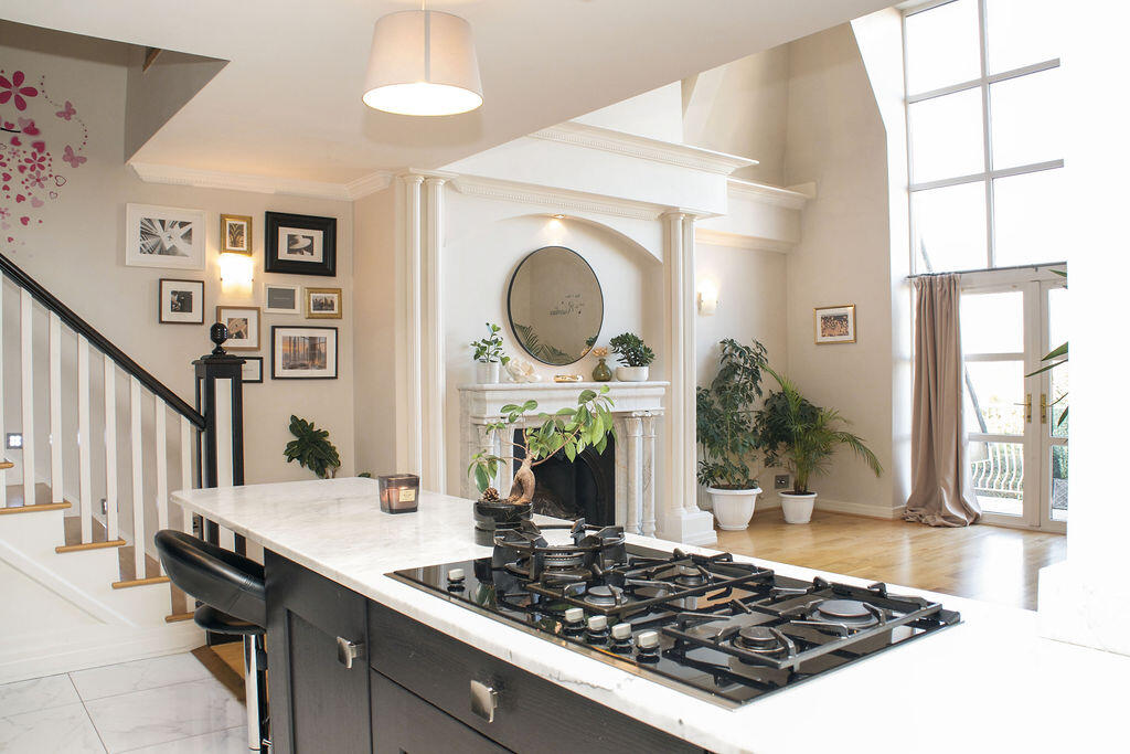 Penthouse photography studio in Dublin with natural light, marble fireplace and gallery wall.
