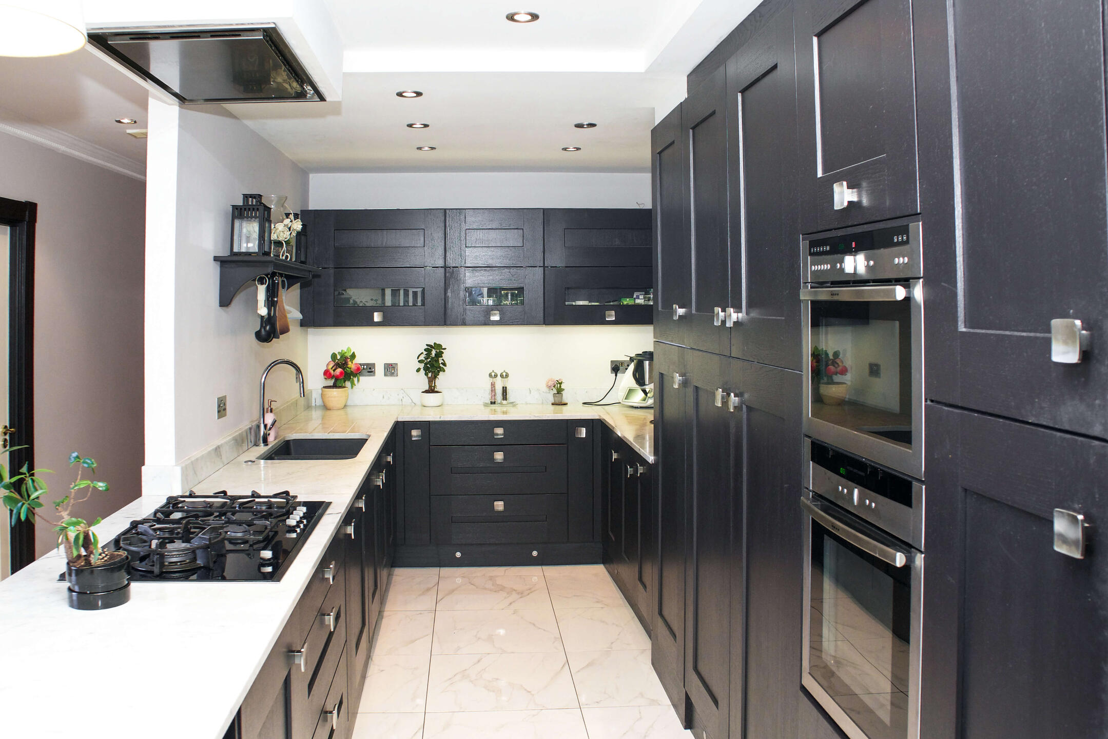 Penthouse photography studio in Dublin with natural light, marble fireplace and gallery wall.